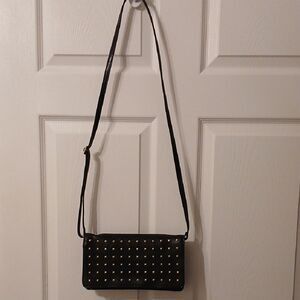 Tignanello Black and Gold Crossbody Bag with Sleek Design Leather